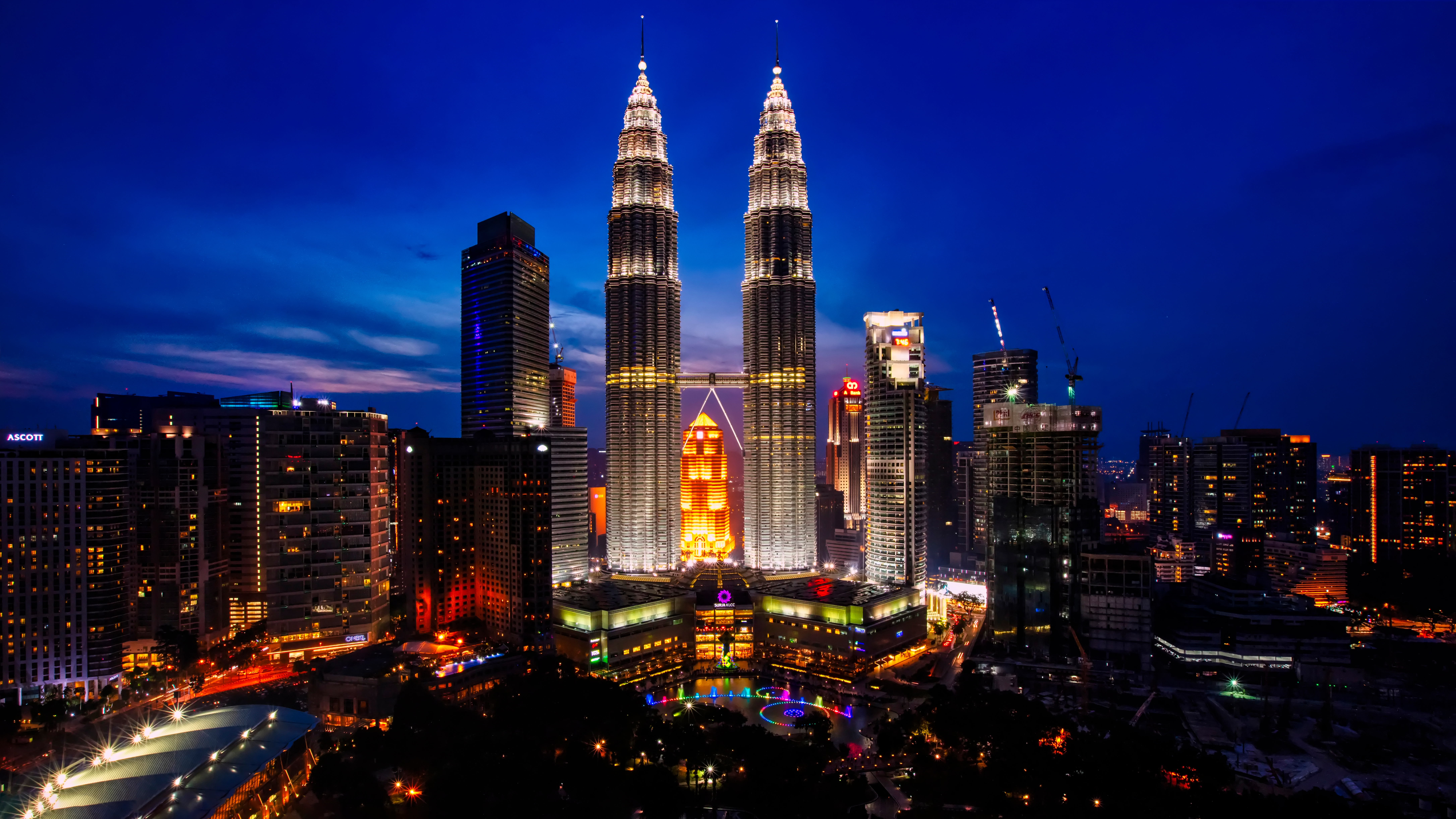 Illuminated Buildings In City At Night